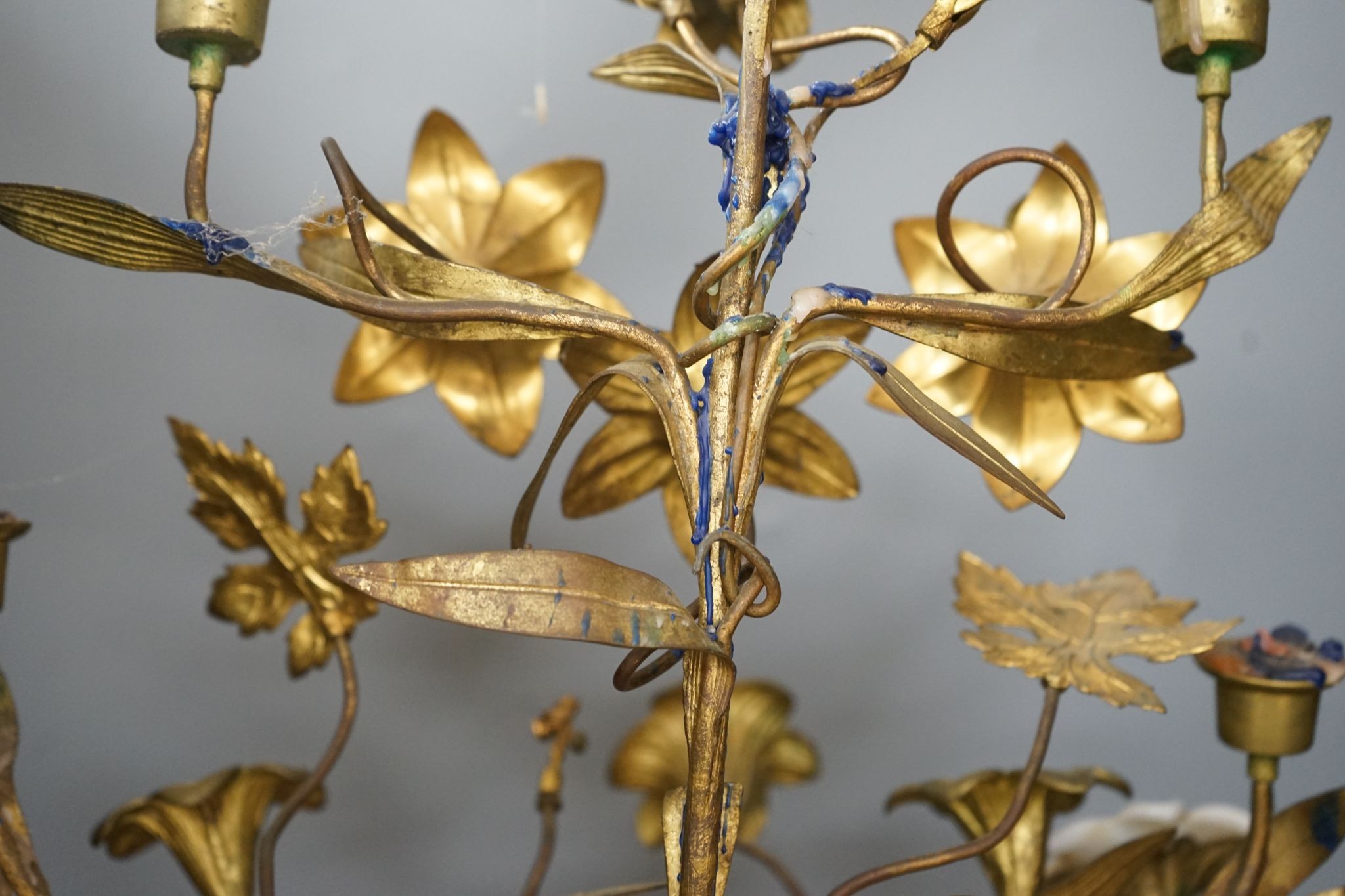 A Victorian cast gilt metal candelabrum, mounted with glass flower heads